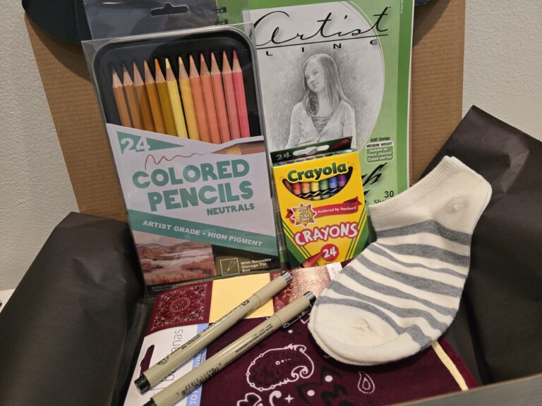 Contents of ICANCERVIVE healing kits including art supplies, comfort items, journaling materials, and tactile therapy components for pediatric, young adult, and adult cancer patients